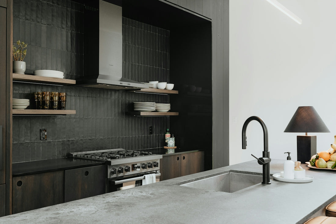 a kitchen with a sink and a stove top oven