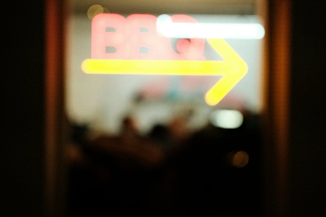 Blurred neon sign with arrow points right